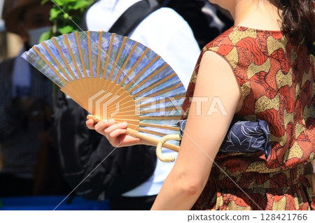 A woman caught in a fan A woman caught in a fan 128421766