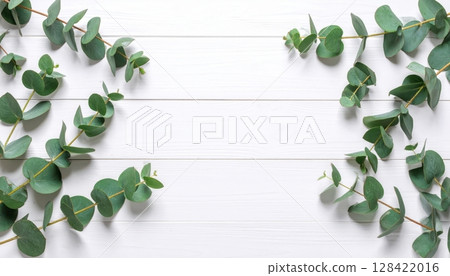 Green leaves frame a wooden background with a fresh floral border illustrating natural spring foliage Green leaves frame a wooden background with a fresh floral border illustrating natural spring foliage 128422016