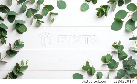 Green leaves frame a wooden background with a fresh floral border illustrating natural spring foliage Green leaves frame a wooden background with a fresh floral border illustrating natural spring foliage 128422017