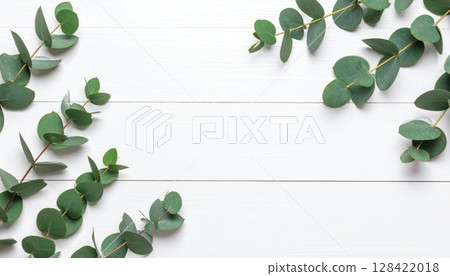 Green leaves frame a wooden background with a fresh floral border illustrating natural spring foliage Green leaves frame a wooden background with a fresh floral border illustrating natural spring foliage 128422018