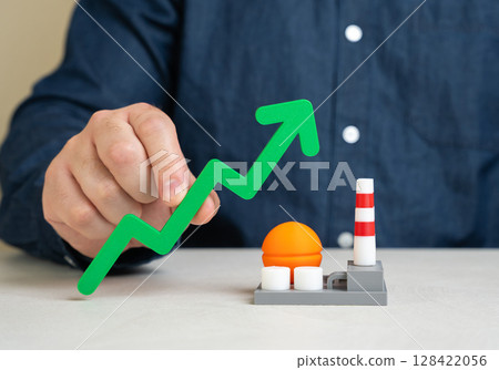 Green arrow up and energy plant. Growth of chemical or energy sector of the economy. Investment growth, increased production output, or rising demand for resources like electricity and chemicals. Green arrow up and energy plant. Growth of chemical or energy sector of the economy. Investment growth, increased production output, or rising demand for resources like electricity and chemicals. 128422056
