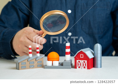 A man explores sectors of the economy. Analysis of economic structure, industrial contributions to GDP, or identifying growth areas. A man explores sectors of the economy. Analysis of economic structure, industrial contributions to GDP, or identifying growth areas. 128422057