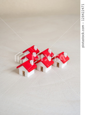 Group of figurine houses. Real estate and housing. Affordable housing, population density, or homeownership trends. 128422471