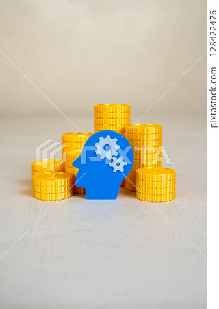 Head with gears and stacks of coins. Invest in education. Make money on an idea. Entrepreneurship, creative economy, and professional growth through learning. Head with gears and stacks of coins. Invest in education. Make money on an idea. Entrepreneurship, creative economy, and professional growth through learning. 128422476
