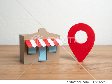 Shop and red geolocation sign. Advertising and presenting your business on maps and social networks. Geotargeting, SEO for businesses, or location-based customer acquisition. Shop and red geolocation sign. Advertising and presenting your business on maps and social networks. Geotargeting, SEO for businesses, or location-based customer acquisition. 128422480