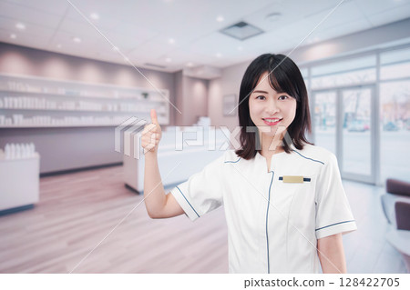 Young female staff working at a cosmetics store 128422705