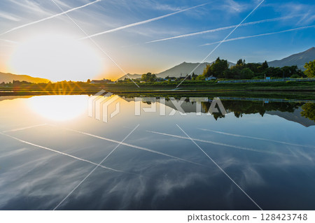 A spectacular reflection of the sunset and Mount Aso in the background (Aso, Minamiaso Village) A spectacular reflection of the sunset and Mount Aso in the background (Aso, Minamiaso Village) 128423748