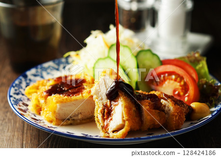 Chicken cutlet with special sauce 128424186