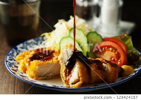Chicken cutlet with special sauce 128424187