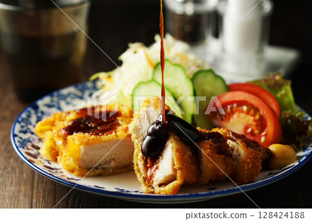 Chicken cutlet with special sauce 128424188