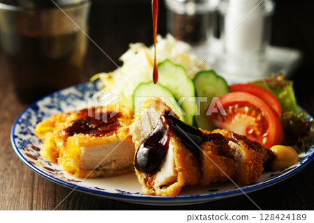 Chicken cutlet with special sauce 128424189