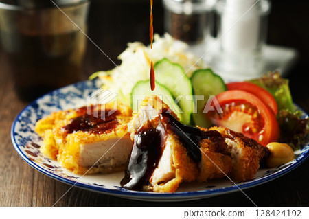 Chicken cutlet with special sauce 128424192