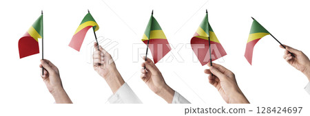 The Congo flag in hand in different angles on a white background The Congo flag in hand in different angles on a white background 128424697