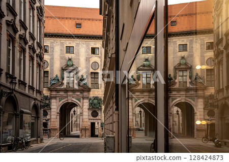 Munich Residenz Facing Residenzstrasse: Historic Royal Palace Entrance With Sculptures And Ornate Facade Between Narrow Streets In The City Center Munich Residenz Facing Residenzstrasse: Historic Royal Palace Entrance With Sculptures And Ornate Facade Between Narrow Streets In The City Center 128424873