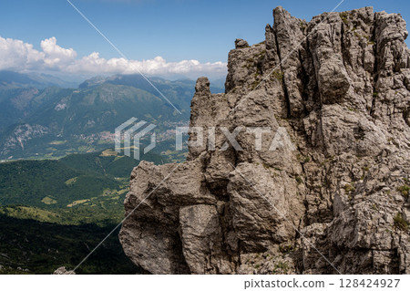 Rugged Alpine Peaks And Verdant Valleys In The Grigna Massif: Scenic Mountain Landscape In Lombardy Region Of Northern Italy Near Lake Como 128424927