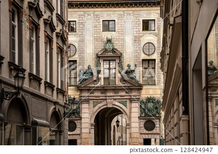 Munich Residenz Facing Residenzstrasse: Historic Royal Palace Entrance With Sculptures And Ornate Facade Between Narrow Streets In The City Center Munich Residenz Facing Residenzstrasse: Historic Royal Palace Entrance With Sculptures And Ornate Facade Between Narrow Streets In The City Center 128424947