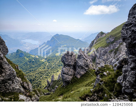 Rugged Alpine Peaks And Verdant Valleys In The Grigna Massif: Scenic Mountain Landscape In Lombardy Region Of Northern Italy Near Lake Como 128425008