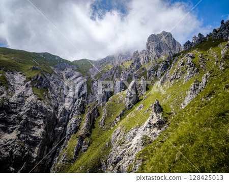 Rugged Alpine Peaks And Verdant Valleys In The Grigna Massif: Scenic Mountain Landscape In Lombardy Region Of Northern Italy Near Lake Como 128425013