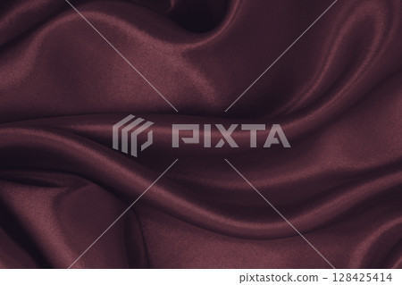 Smooth elegant pink silk or satin luxury cloth texture as abstract background. Luxurious valentines day background design 128425414