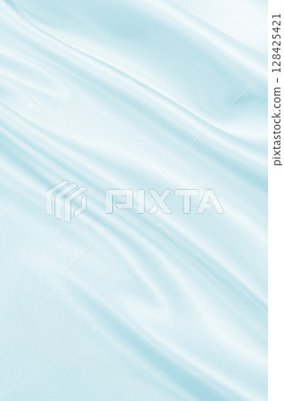 Smooth elegant blue silk or satin luxury cloth texture as abstract background. Luxurious background design 128425421