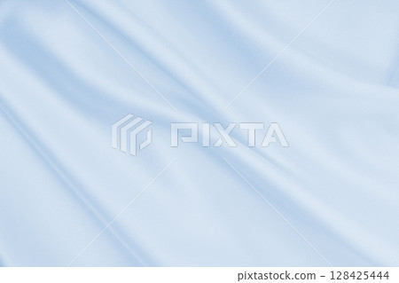 Smooth elegant blue silk or satin luxury cloth texture as abstract background. Luxurious background design Smooth elegant blue silk or satin luxury cloth texture as abstract background. Luxurious background design 128425444