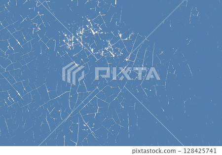 Abstract textured pattern with cracks on a blue background 128425741