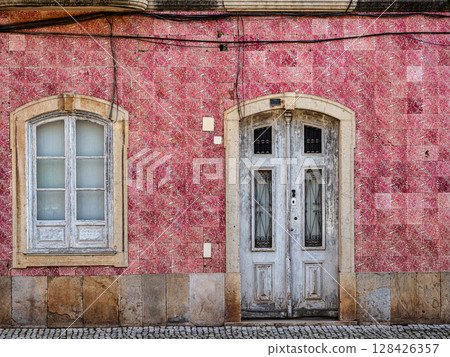 View of modern and historic buildings in the center of Silves, Algarve region, Portugal. View of modern and historic buildings in the center of Silves, Algarve region, Portugal. 128426357