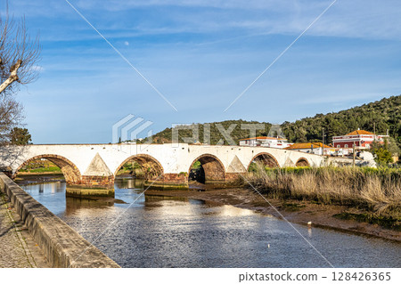 The Roman bridge, Ponte Romana in the city of Silves in the Algarve region of Portugal. 128426365
