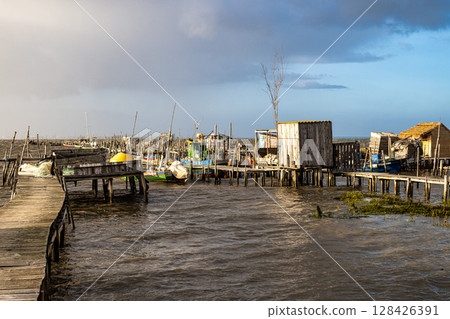Traditional fishermen wooden jetties Cais Palafitico on Carrasqueira, Alcacer do Sal, Setubal, Portugal 128426391