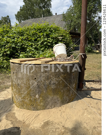 A mine well with concrete rings. Topped with white sand for protection and filtration. A mine well with concrete rings. Topped with white sand for protection and filtration. 128426611