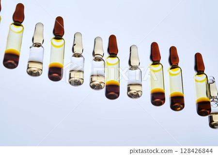 Various ampoules with drugs. View from below. 128426844