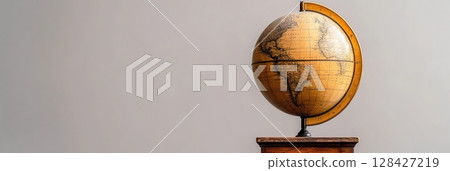 Antique Globe on Wooden Stand World Map Travel Exploration Geography old gold land brown earth ocean 128427219