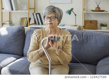 Senior old elder woman alone at home, lonely pensive pleasant grandmother, elderly person retired  128427580