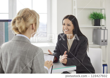 Happy Coworkers Managing Business Accounting In Meeting 128427602