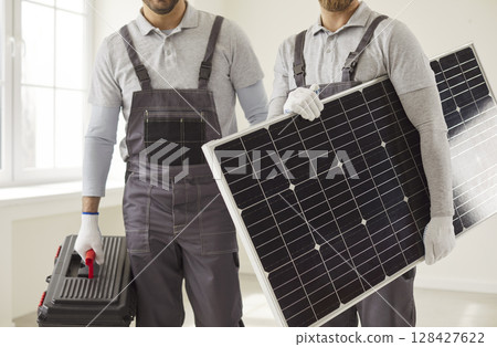 Workers team home, office battery installations, indoors, outside polycrystalline solar panel power  128427622