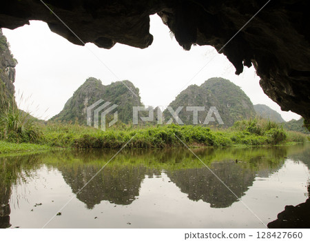 Limestone cliffs reflected in the water. 128427660