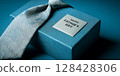 Gift father day. Blue  tie,  box with text  Happy fathers day on blue background.  Fathers Day concept. 128428306