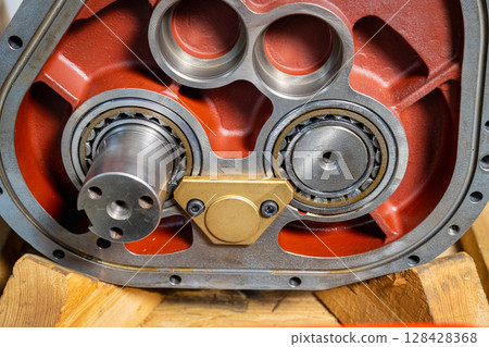 Close up of gearbox housing showing ball bearings and shaft Close up of gearbox housing showing ball bearings and shaft 128428368
