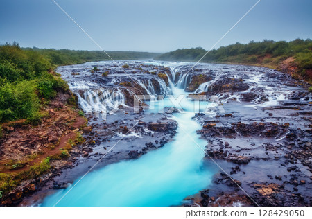 Dramatic views of the bright Bruarfoss waterfall. Popular tourist attraction. Location place South Iceland, Europe. Dramatic views of the bright Bruarfoss waterfall. Popular tourist attraction. Location place South Iceland, Europe. 128429050