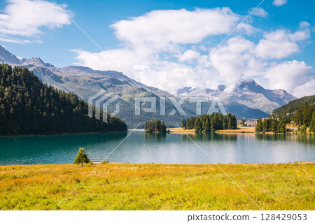 Great view of the azure pond Champfer. Location Swiss alps, Silvaplana village, district of Maloja, Europe. Great view of the azure pond Champfer. Location Swiss alps, Silvaplana village, district of Maloja, Europe. 128429053