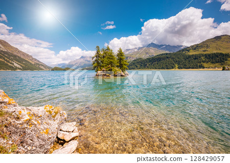 Great view on azure lake Silsersee (Sils) and peak Piz Corvatsch in the Swiss alps. Location Upper Engadine valley, Europe. 128429057