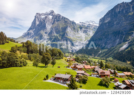 Impressive view of alpine Eiger village. Popular tourist attraction. Location place Swiss alps, Grindelwald valley, Europe. 128429100