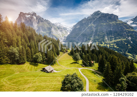 Impressive view of alpine Eiger village. Location place Swiss alps, Grindelwald valley, Europe. Impressive view of alpine Eiger village. Location place Swiss alps, Grindelwald valley, Europe. 128429102