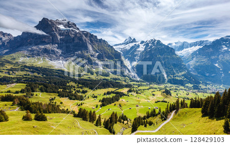 Impressive view of alpine Eiger village. Popular tourist attraction. Location place Swiss alps, Grindelwald valley, Europe. 128429103