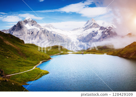 Panorama of Mt. Schreckhorn and Wetterhorn above Bachalpsee lake. Location Swiss alps, Bernese Oberland, Grindelwald, Europe Panorama of Mt. Schreckhorn and Wetterhorn above Bachalpsee lake. Location Swiss alps, Bernese Oberland, Grindelwald, Europe 128429109