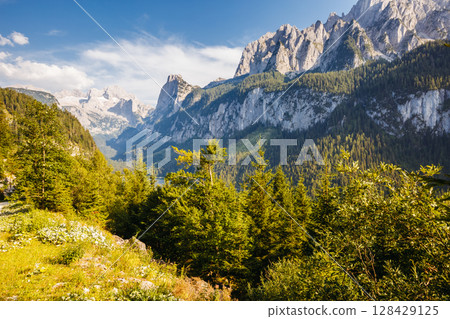 Alpine lake Vorderer Gosausee. Salzkammergut is a famous resort area located in the Gosau Valley in Upper Austria. Dachstein glacier. Alpine lake Vorderer Gosausee. Salzkammergut is a famous resort area located in the Gosau Valley in Upper Austria. Dachstein glacier. 128429125
