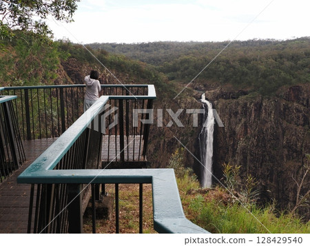 The sound of water crashing over the cliffs - Wallaman Falls and the edge of the view The sound of water crashing over the cliffs - Wallaman Falls and the edge of the view 128429540