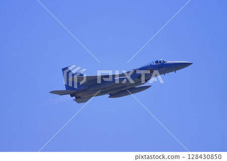 Japan Air Self-Defense Force F-15 fighter jet taking off into the sky 128430850