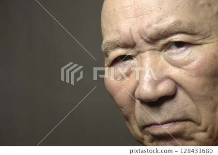 An old man with a troubled face An old man with a troubled face 128431680