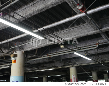 Viaduct seen from below Serious world Concrete jumble emergency exit Copy space 128433071
